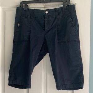 INC capri pants.   Navy blue with silver decorative buttons on all pockets.